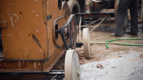 A close up of a concrete mixer's mechanism