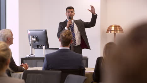 businessman making presentation at conference shot on r3d