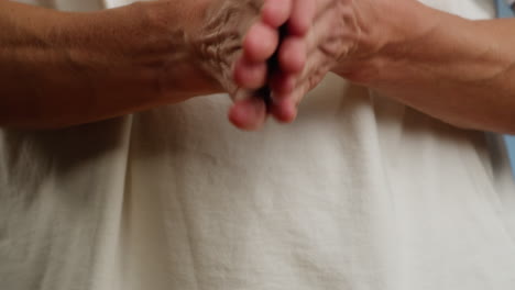 young man squeezing a yellow gel moisturizer oil from a tube on his hand close-up. morning routine. beauty and care concept. skin texture.