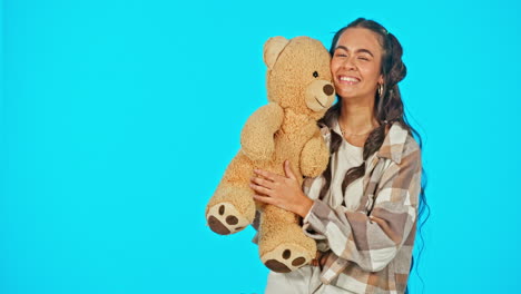 Teddy-bear,-hugging-and-happy-with-woman-in-studio