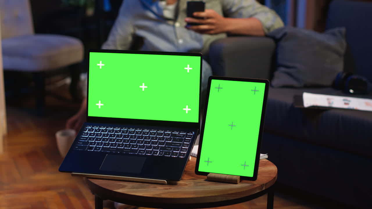 African american man browses mobile phone next to mockup copy space