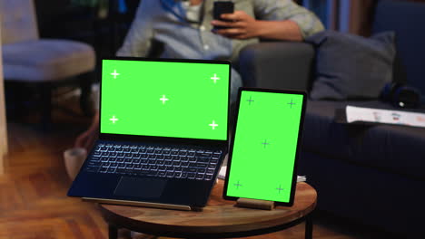 african american man browses mobile phone next to mockup copy space