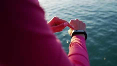 hispanic caucasian female wrist with heart rate monitor