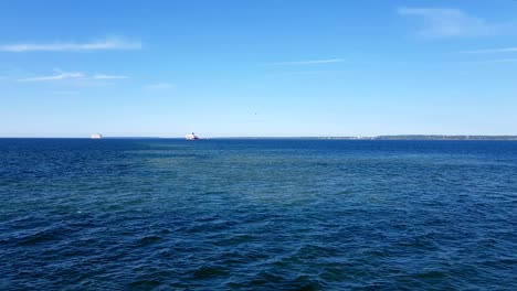 view of the ocean and clouds in the sky. blue sky with clouds in sunny weather over the ocean.