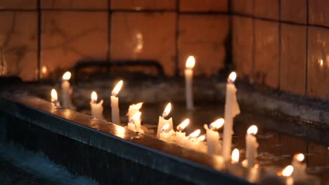 burning candles in a tray