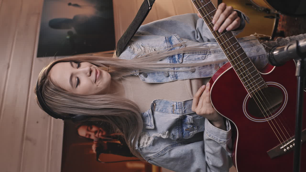 Portrait Of Young Woman Playing Acoustic Guitar