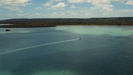 aerial tracking of fast boat in basket bay, new caledonia