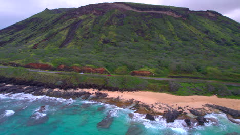 landscape view of koko crater reveal in oahu hawaii and the pacific ocean and sandy beach park at sunrise