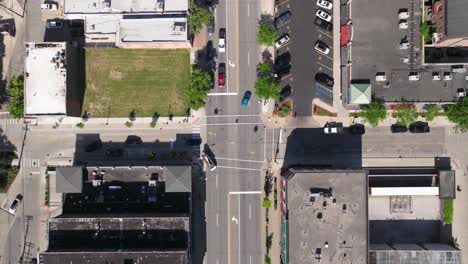 Downtown-Dearborn,-Michigan-intersection-with-traffic-and-stable-drone-video-looking-down-from-overhead