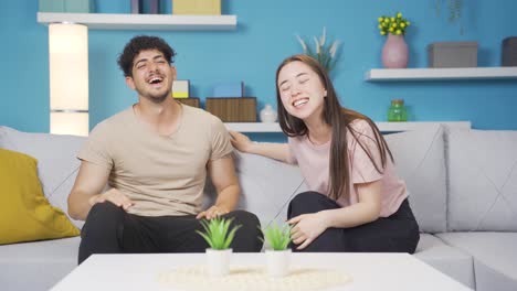 European-Boy-and-Asian-girl-having-fun-chat-at-home.