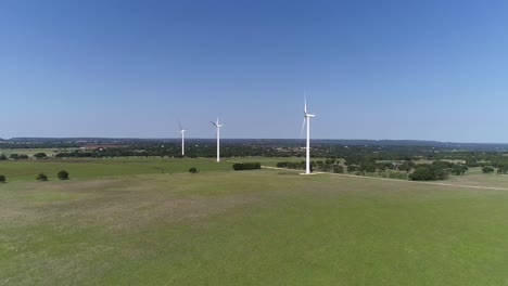 aerial video of 3 wind turbines