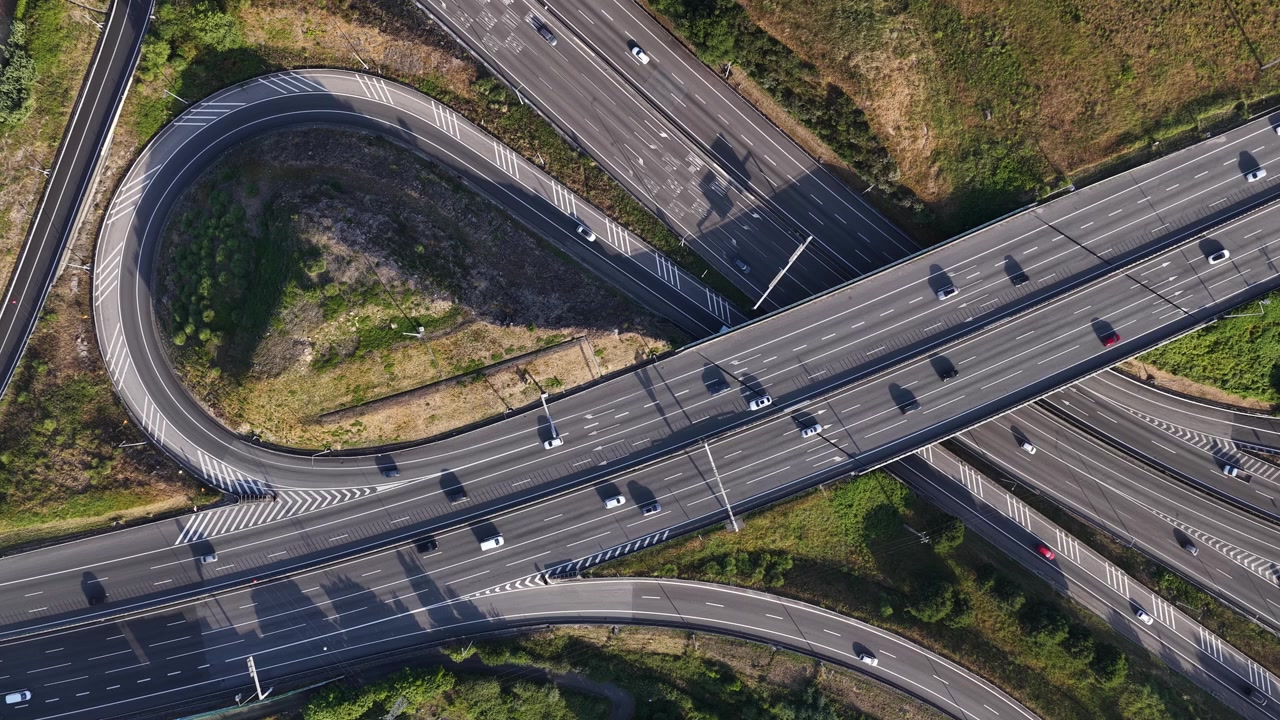 Aerial Cityscape Highway Interchanges during Peak Hour