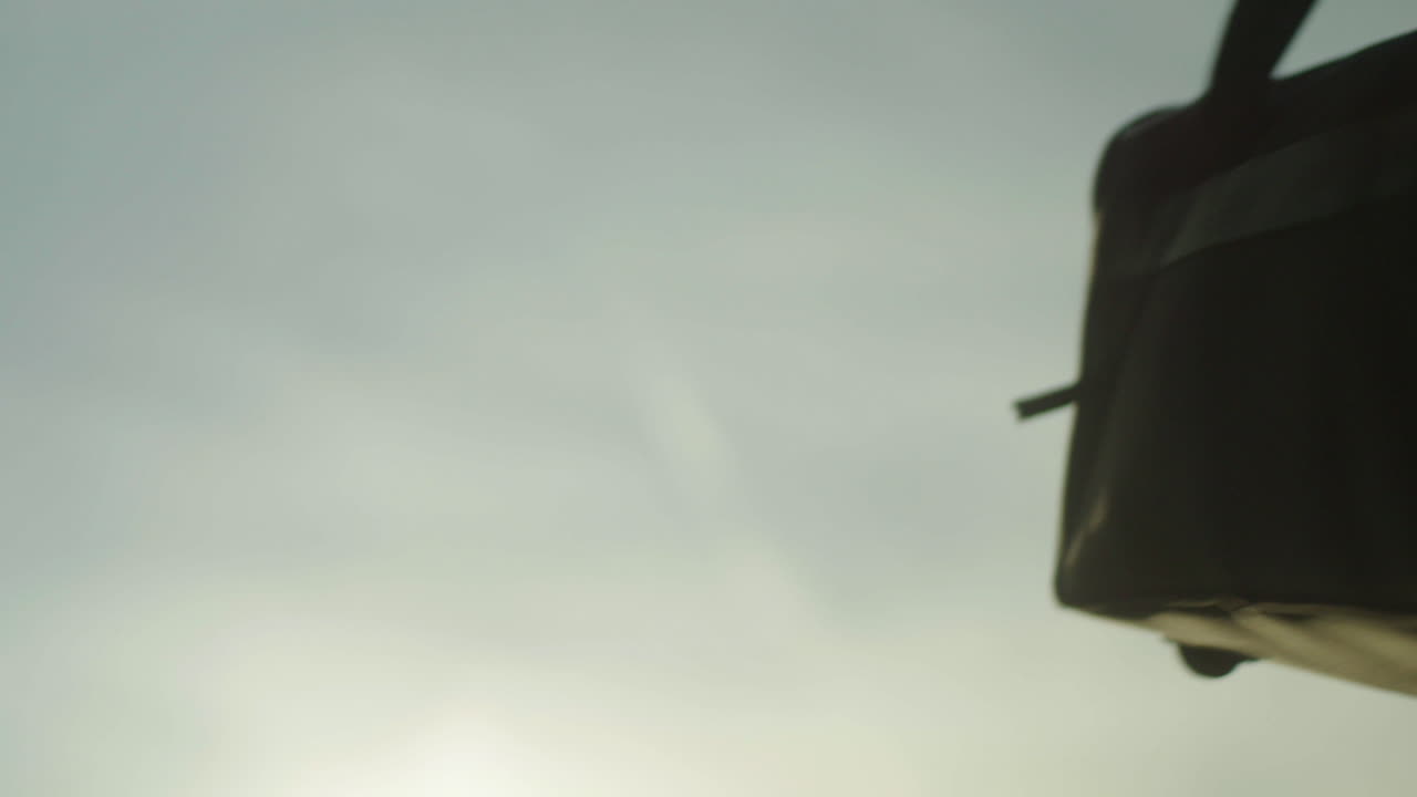 People Carrying a Bag