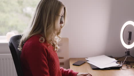 woman working at desk in home office