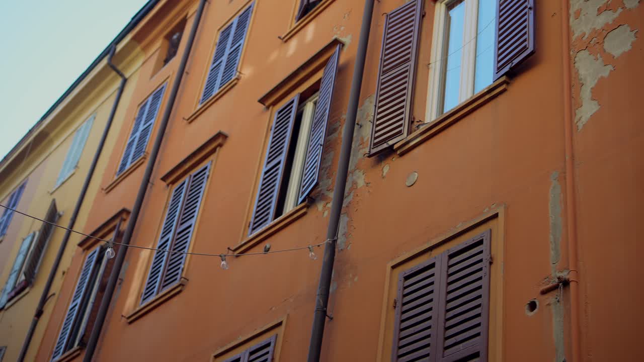 Italian Building with Brown Shutters