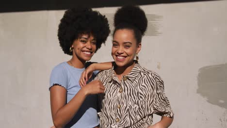 front view of two mixed race women smiling
