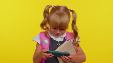 Worried-funny-school-girl-wear-backpack-enthusiastically-playing-racing-video-games-on-mobile-phone