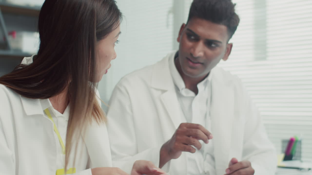Technicians Repairing Broken Phone with Screwdriver