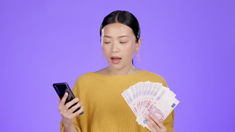 phone, money and shocked asian woman in studio