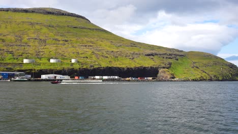 view of a salmon fishery on the island of vagar observed from a boat en route to mykines, faroe islands