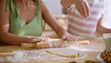 mother and child baking cookies together