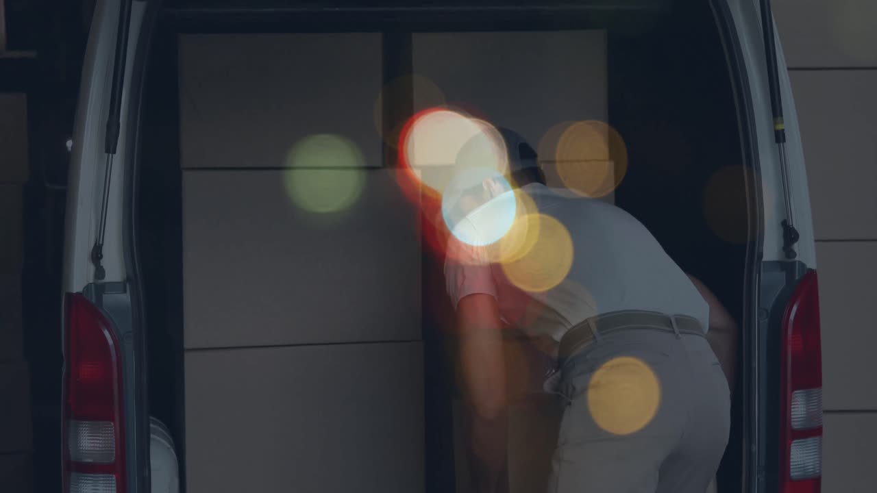 Animation of road at night over caucasian male deliverer with cartons