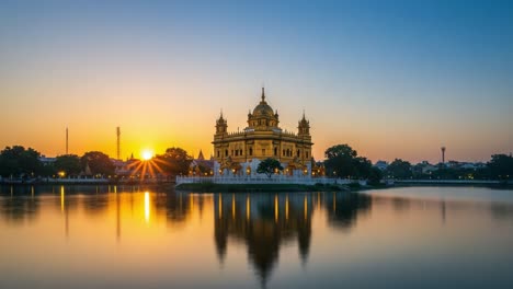 a captivating sunset reflection of a majestic golden temple surrounded by calm waters and vibrant skies in the tranquil evening light