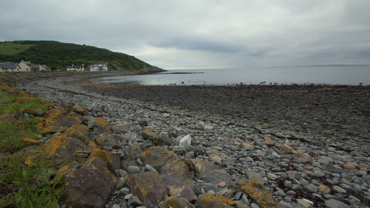 extra wide Shot looking south down Stairhaven Beach at low tide