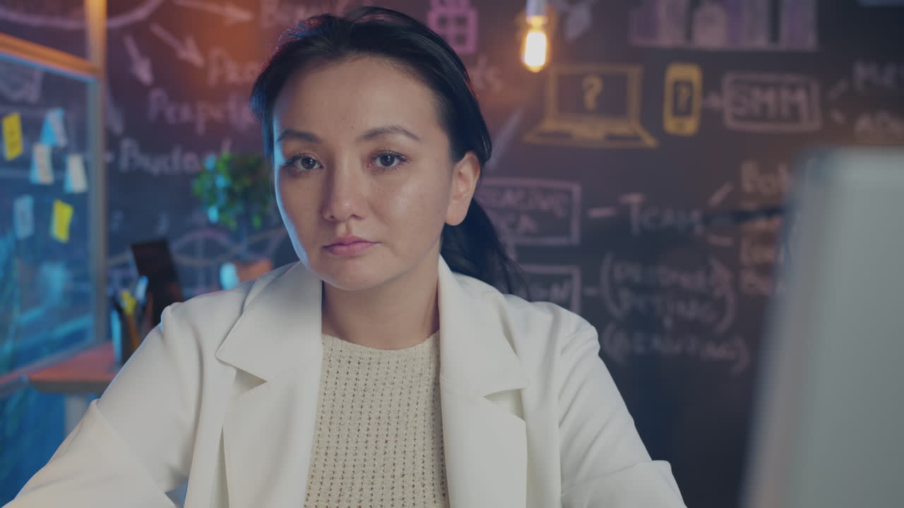 Asian Woman Working at Laptop