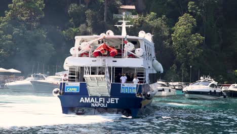 a ferry leaves the harbor in sorrento, italy