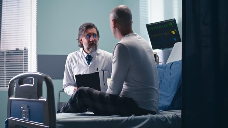 Doctor and Patient Consultation in Hospital Room