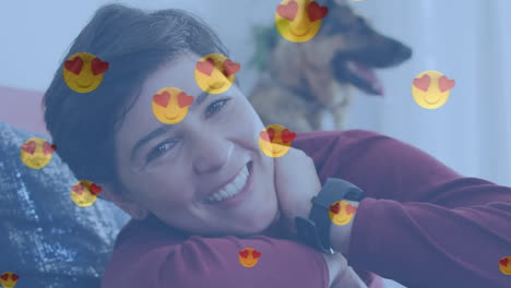 animación de emojis de corazón sobre feliz mujer caucásica con perro