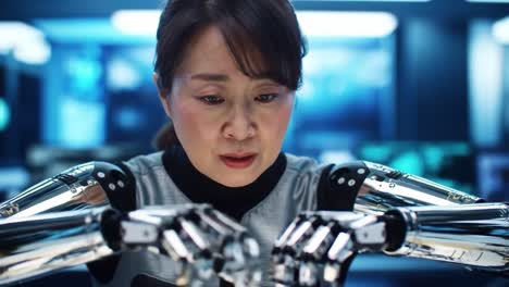 woman with bionic arms in a lab