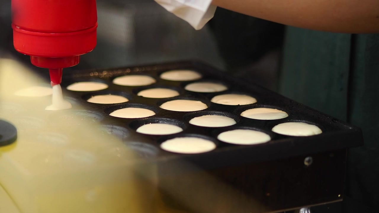 Chef Pouring Batter into Takoyaki Pan