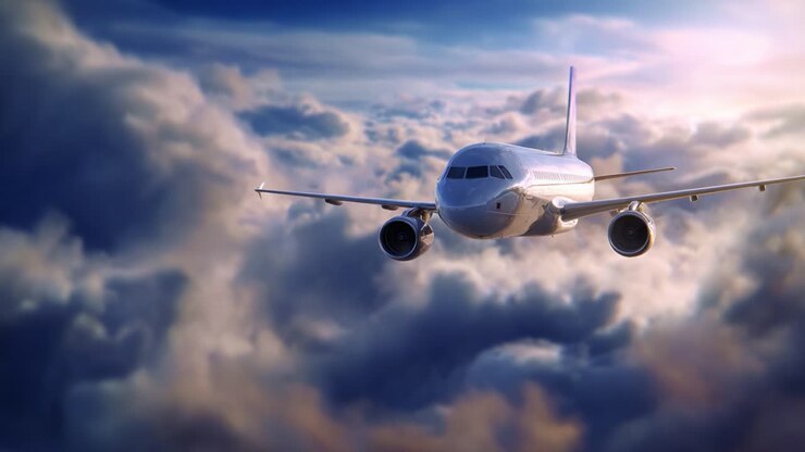 Un avion majestueux s’élève au-dessus des nuages, capturant la beauté du vol et la liberté dans un horizon époustouflant de couleurs et une couverture nuageuse duveteuse