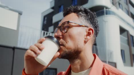 man enjoying coffee outdoors