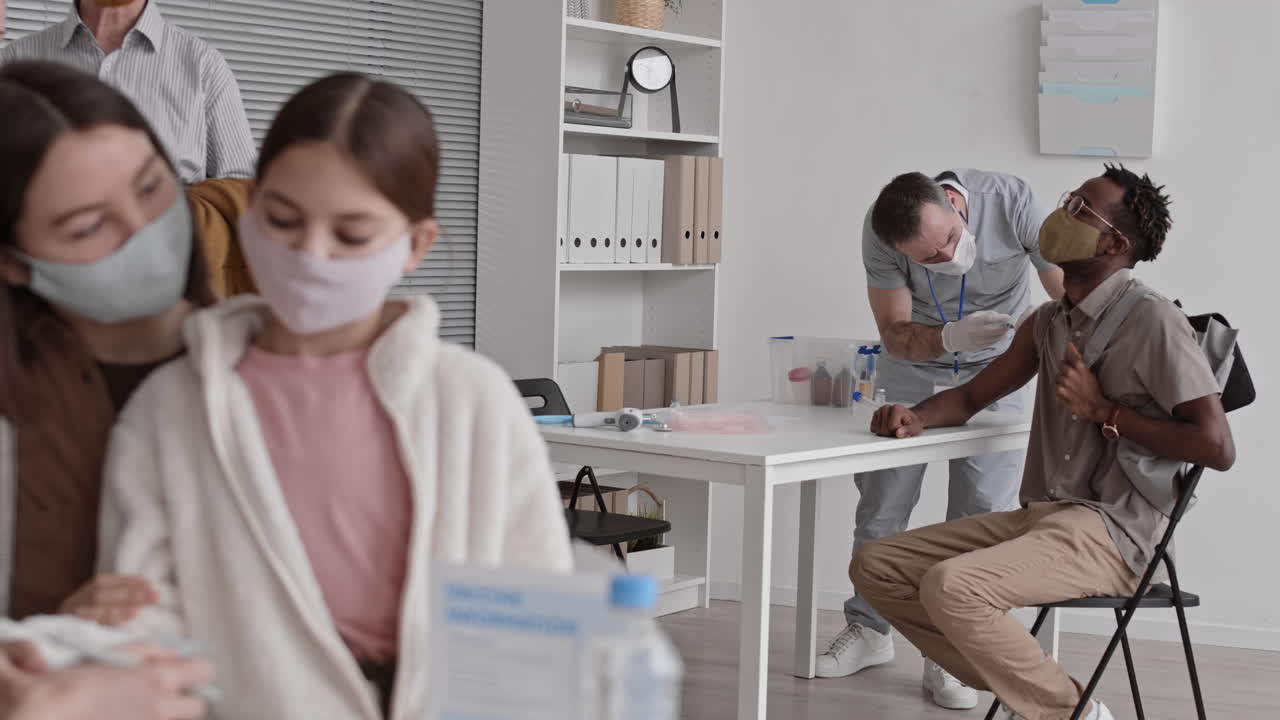 African Man Vaccinated in Busy Hospital