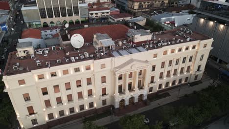 Establishing-drone-aerial-shot-of-National-Bank-of-Development-in-the-financial-district-downtown-in-Asuncion-city,-Paraguay