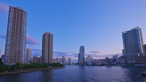 Evening-Tokyo,-Tsukuda,-Toyosu-skyscrapers-and-bridge-the-Sumida-River