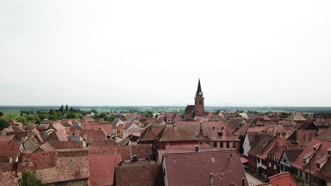 a stationary 360 footage panning to the left while showing the village, the grassland, and the mountains