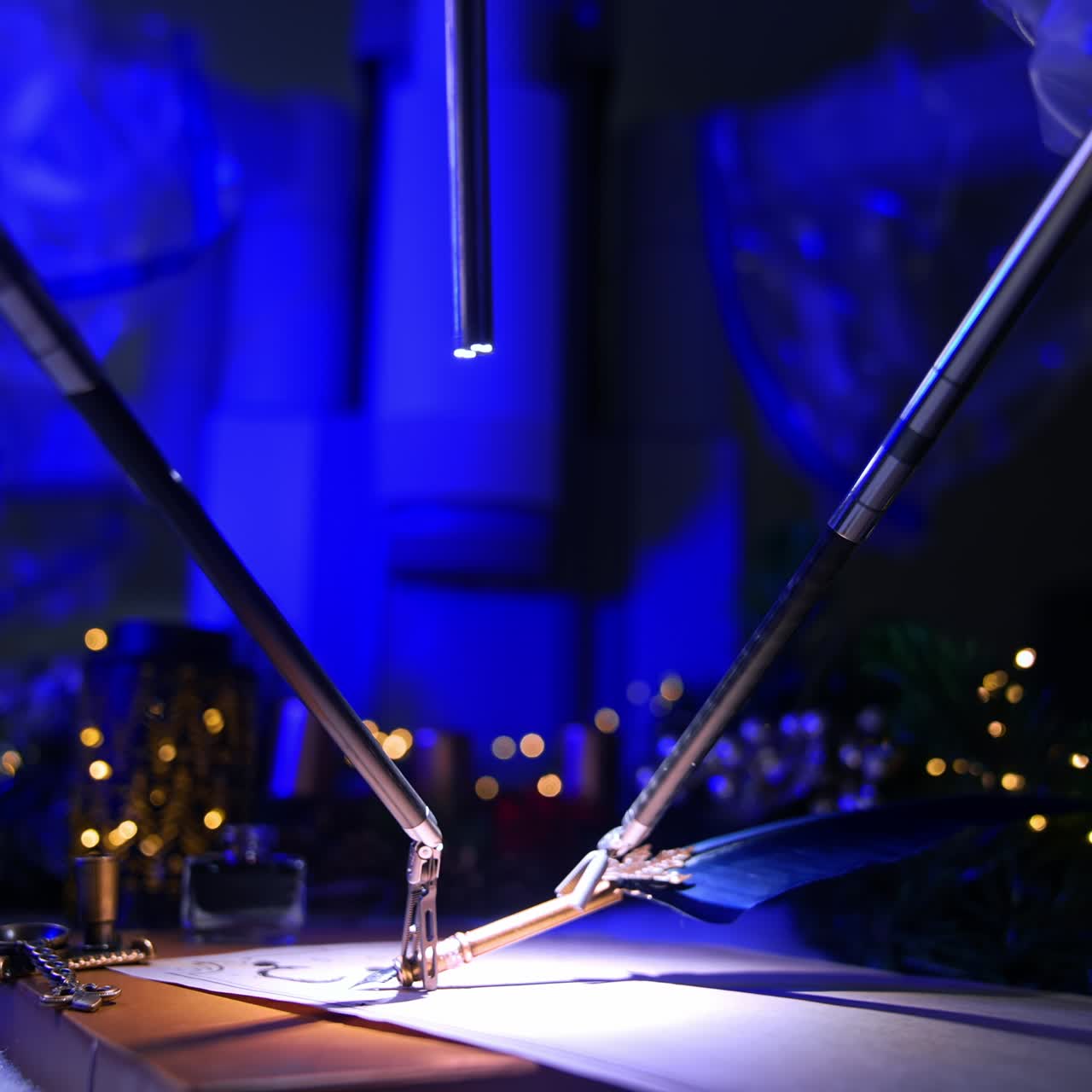 Robotic arms for microsurgery take the old-fashioned writing pen. Christmas garlands and lights at backdrop in dark surgical room