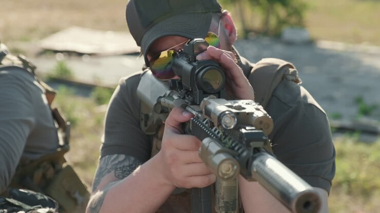 Soldier Looking Through Rifle Day Scope
