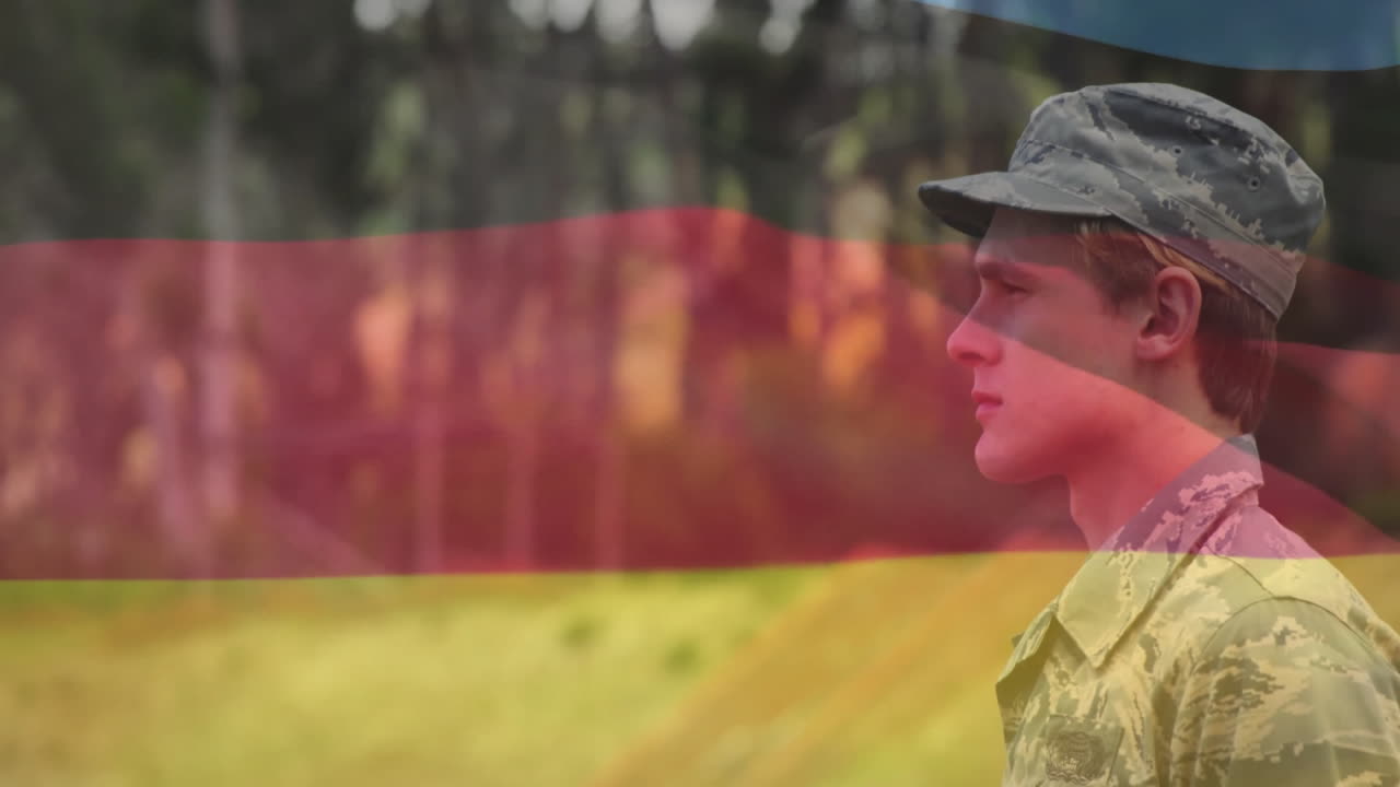 Saluting with flag overlay, soldier in camouflage standing in forest environment