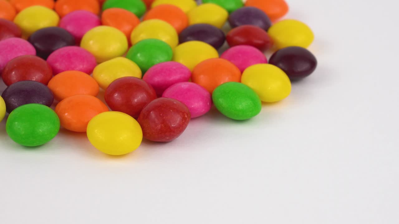 Round candy sweets rotating. Isolated on white. Loopable.