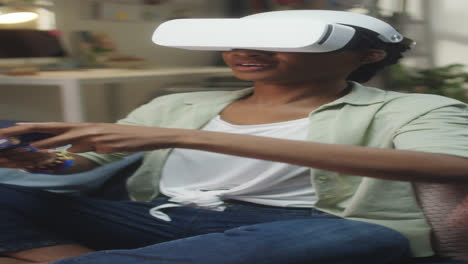 young woman playing game in vr at home