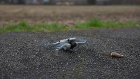 White-drone-takes-off-from-ground