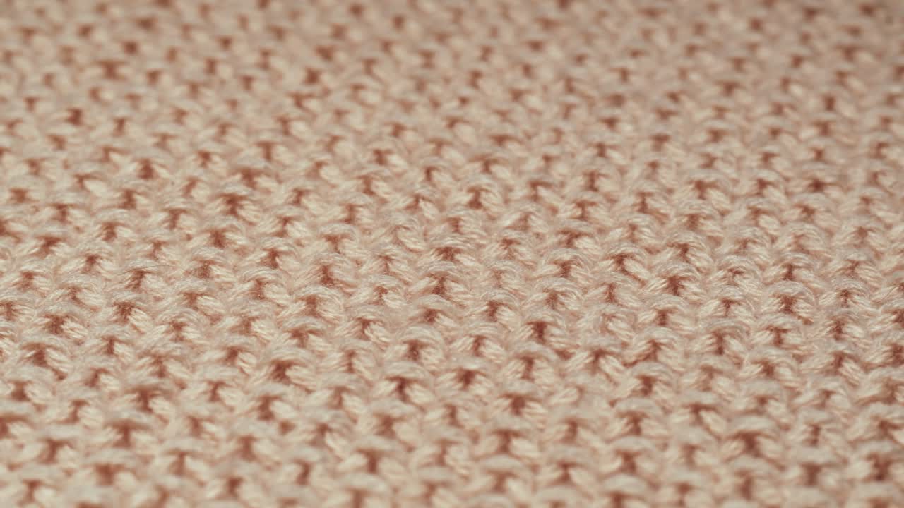 Detail béžové pletené látky