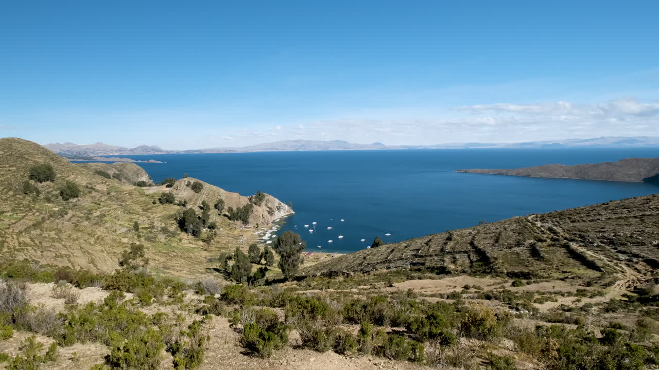 Showcases the Yumani community on Isla del Sol, Copacabana, Bolivia. Traditional village life, terraced landscapes, and stunning panoramic views of Lake Titicaca