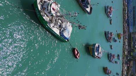 Aerial-View-Over-Moored-Fishing-Boats-In-Port-Of-San-Antonio-In-Chile