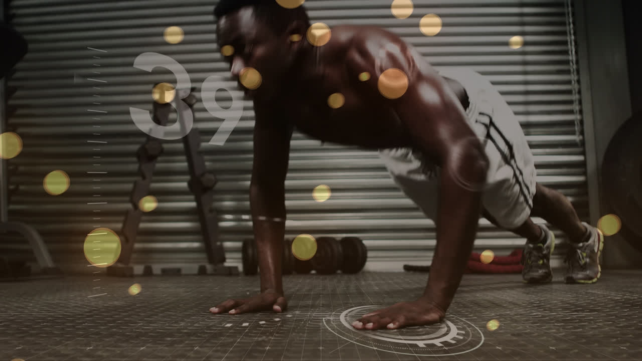 Animation of glowing lens flare and counter over african american man doing push-up in gym
